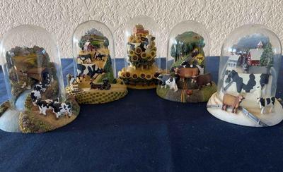 Franklin mint cow sculptures under globes