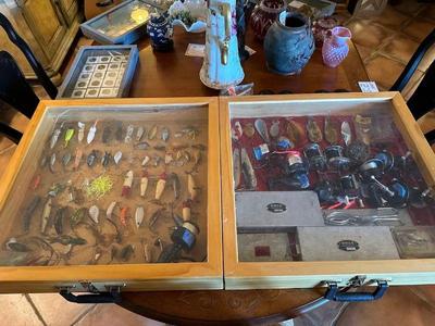 Vintage fishing lures and reels! Plus other gear is in our packed garage. "Reely awesome! lol