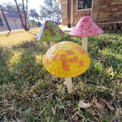 3) mushrooms yard art