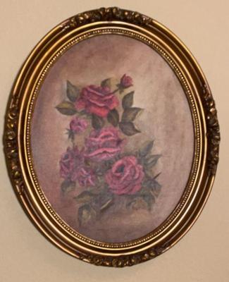 Oil painting of roses in a oval frame