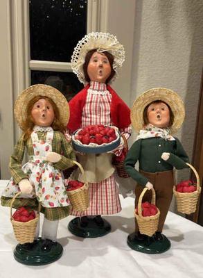 Byers choice carolers selling strawberries