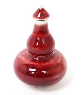 Lot 428 chinese ox blood guard shaped snuff bottle