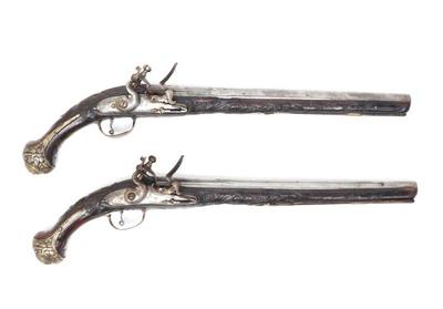 Lot 129 brace of ornate silver carved stock cavalry pistols, 18th c.