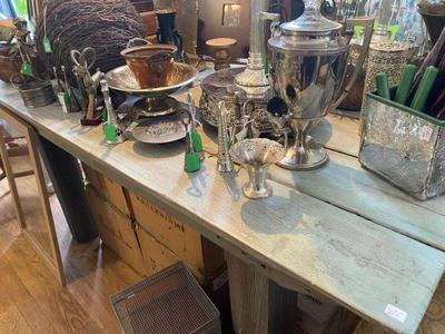 several farm tables throughout the shop and outside