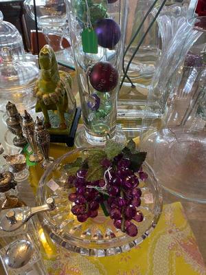 miscellaneous glass bowls and glass grapes throughout store