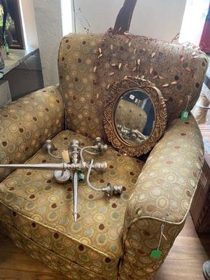 stuffed swivel fabric chair and a pair of silver scones