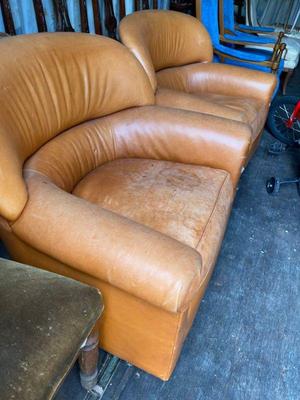 pair of leather barrel chairs by boyd