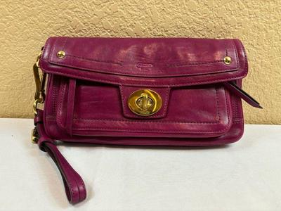 Authentic plum color coach wristlet handbag
