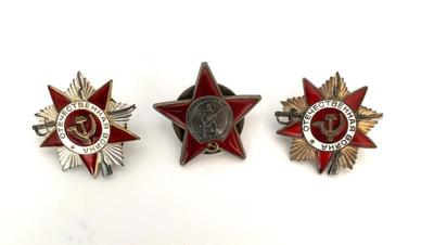 Left and right - Order of the Patriotic War. Center -  USSR Order of the Red Star
