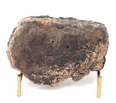 Lot 236 meteorite on stand 4 million years old