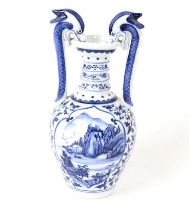 Lot 392 chinese blue white dragon handle vase
