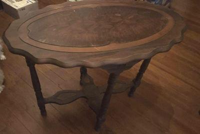 Scalloped edge oval table