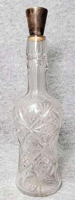 Crystal decanter with sterling silver cap