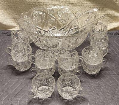 Clear cut glass punch bowl with cups