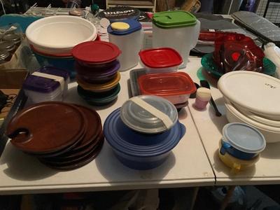 Variety of plastic storage containers with lids. To include some Tupperware