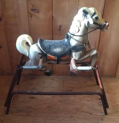 White and grey riding horse