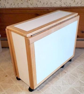 Drop leaf roll away table and chairs unit