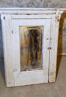Salvaged antique mirrored medicine cabinet