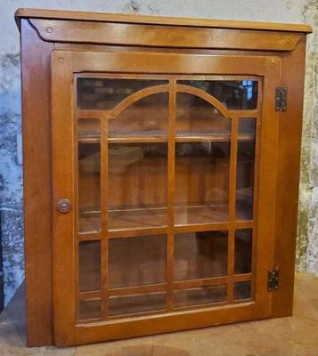 Wooden cabinet with glass door