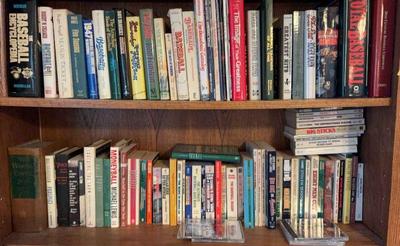 2 shelves of baseball books magazines