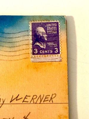 Postmarked violet 3 cent jefferson stamp
