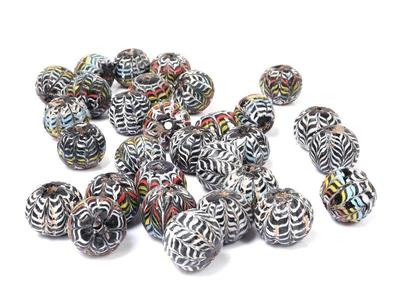 Lot 257 collection of thirty islamic core formed glass beads