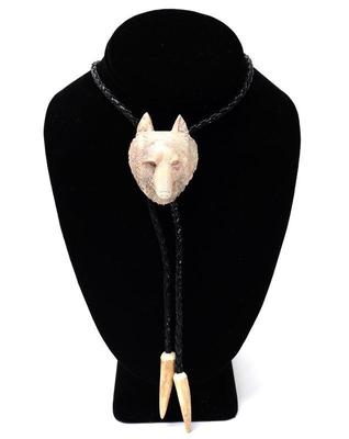 Lot 186 nicely carved wolf antler bolo tie