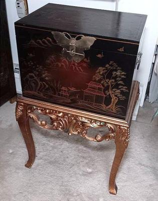 Asian chest on rose color stand