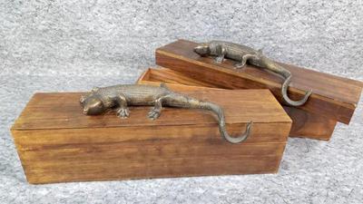 Pair of bronze lizard alligator figures on wood boxes
