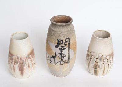 Lot 347 three decorative ceramic jars