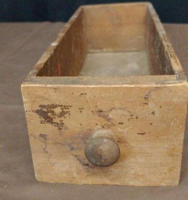 Old treadle sewing machine drawer