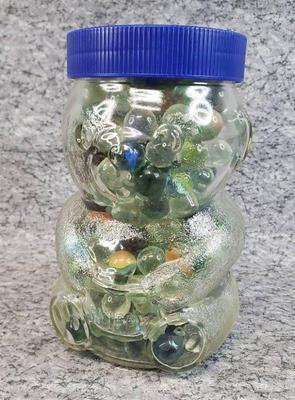 Glass bear jar full of marbles