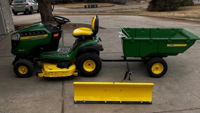 John Deere S240 with snow plow, utility cart, weights and chains (only 47hrs used)