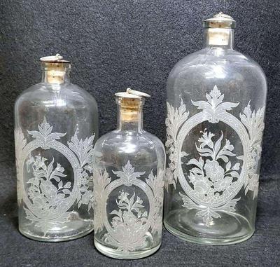 Etched glass decanter bottles