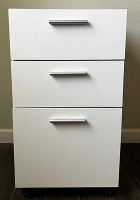 Small white filing drawers