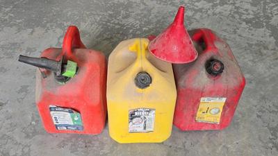 3 Gas Tanks And A Funnel