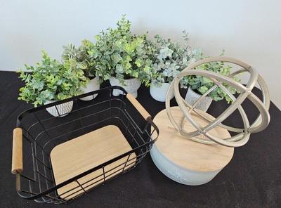 ARTIFICIAL PLANTS, A WIRE BASKET, CANDLE AND MORE DECOR