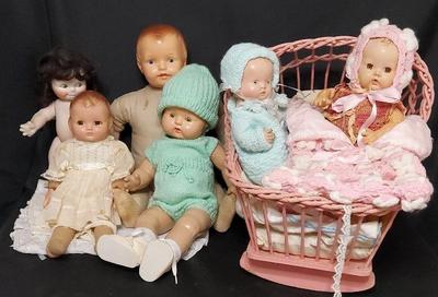VINTAGE/ANTIQUE BABY DOLLS WITH CRADLE