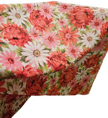 Red and white flowered cloth tablecloth