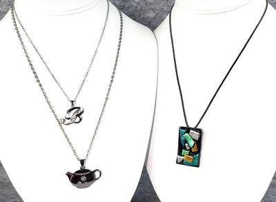 3 costume jewelry necklaces with pendants