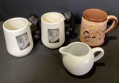 Coffee cups and a creamer