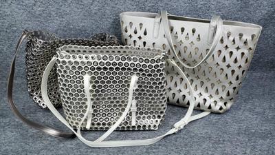 Tote bags metalic finish eyelet and cut out styles