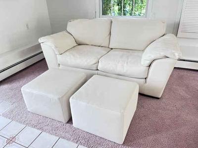 White leather loveseat with ottomans