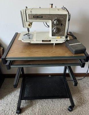 Vintage Sears Kenmore Sewing Machine With Sewing Table On Wheels
Lot #: 409
