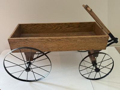 Solid Oak And Iron Wheeled Wagon
Lot #: 91