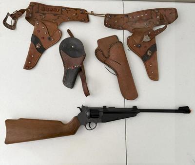 Lot Vintage Leather Children's Holsters & Edison Giocattoli Revolving Rifle Toy
Lot #: 182