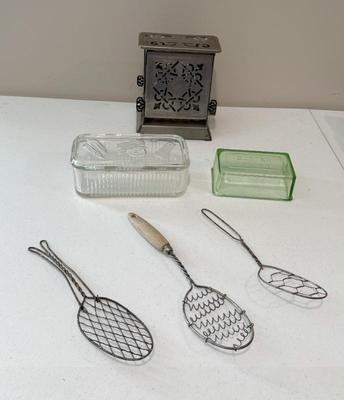 Vintage Kitchenwares Lot- GE Electric Toaster, Slotted Spoons, Depression Glass Butter Cover, Refrigerator Jar
Lot #: 219