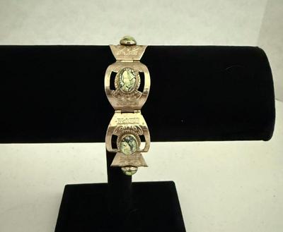 925 Sterling Silver Hinged Bracelet With Iridescent Glass Stones, 6.5" L, 35.47 Grams
Lot #: 11