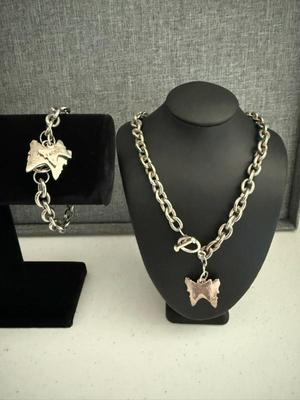 925 Silver & Stainless T & Co Butterfly Charm Bracelet & Necklace
Lot #: 10