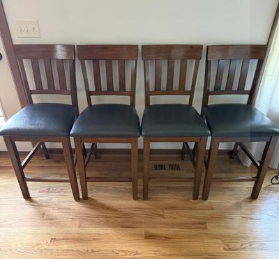 Lot (4) Bar Height Oak Chairs W/black Vinyl Tops
Lot #: 146
